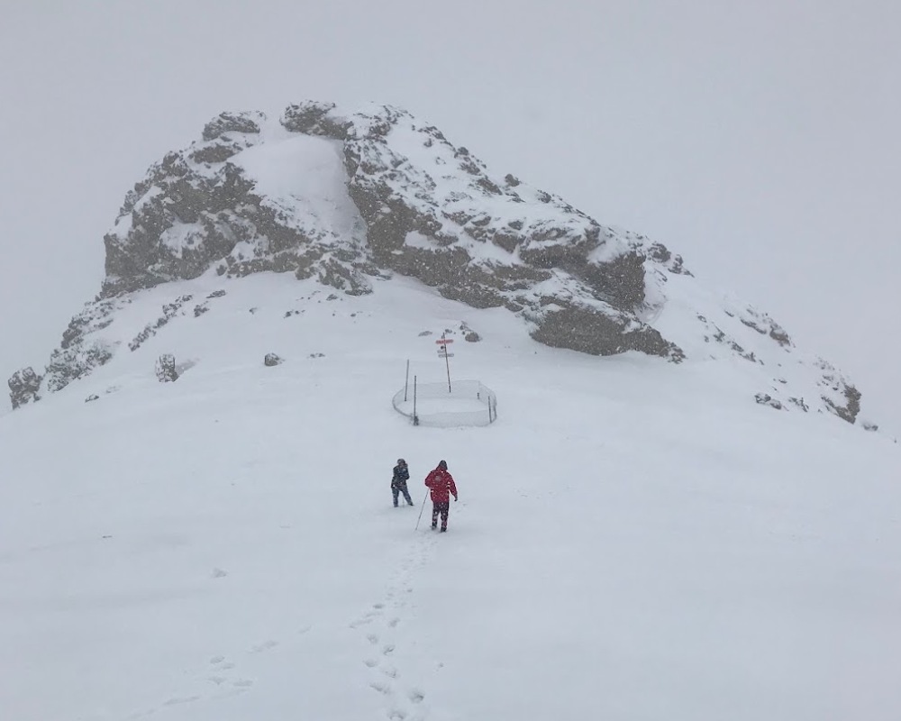 f5bbc950-71a3-4e99-888b-ac1df2b8117b-two-people-among-the-snowy-mountains-of-tochal.jpg