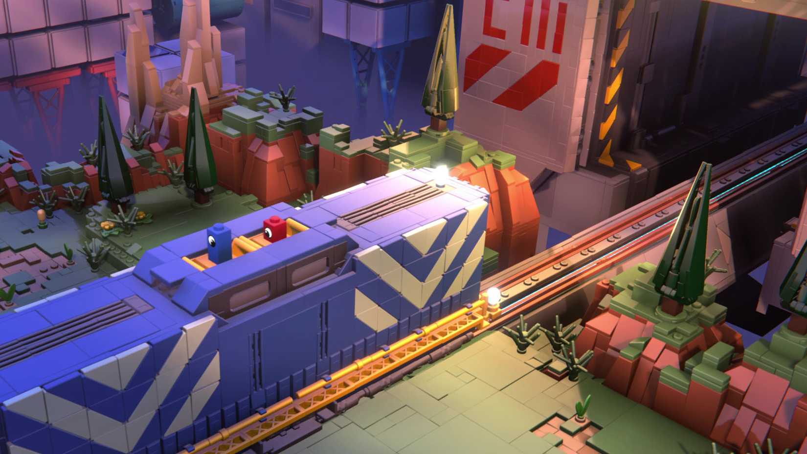 یک تصویر رسمی از Lego Voyagers که دو شخصیت لگویی را بر روی یک قطار آبی نشان می‌دهد.